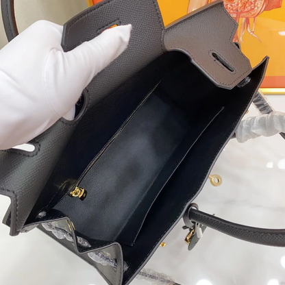 Sleek Solid Black Fine Grain Sharp Seam Structured Trapezoid Tote With Warm Golden Twist Lock Hardware And Detachable Matching Shoulder Strap